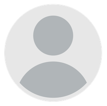 A gray circle with a person 's face in it.