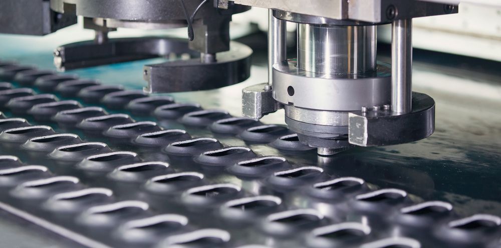 A Machine is Cutting a Piece of Metal in a Factory — Top End Steel Supplies Darwin In Pinelands, NT