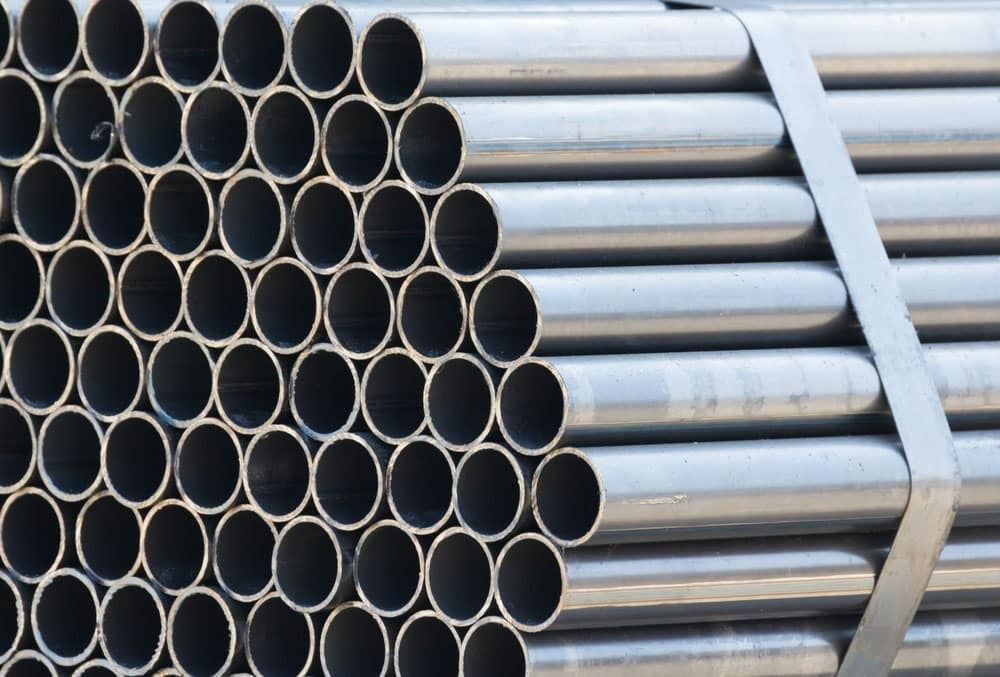 A Bunch of Metal Pipes Stacked on Top of Each Other — Top End Steel Supplies Darwin In Pinelands, NT