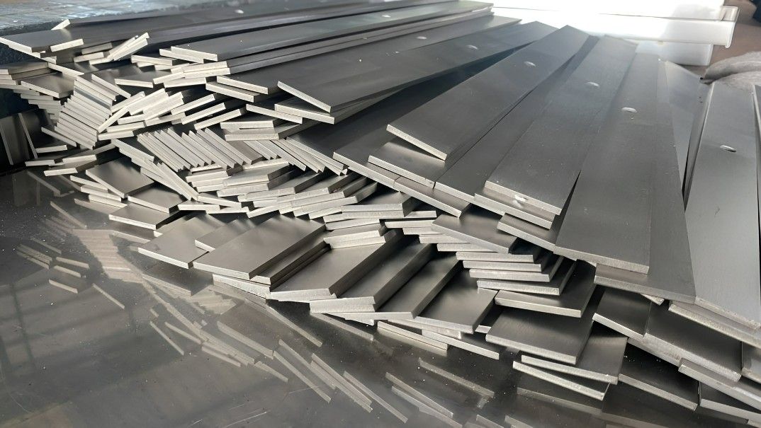 A Pile of Metal Pieces Are Stacked on Top of Each Other — Top End Steel Supplies Darwin In Pinelands, NT