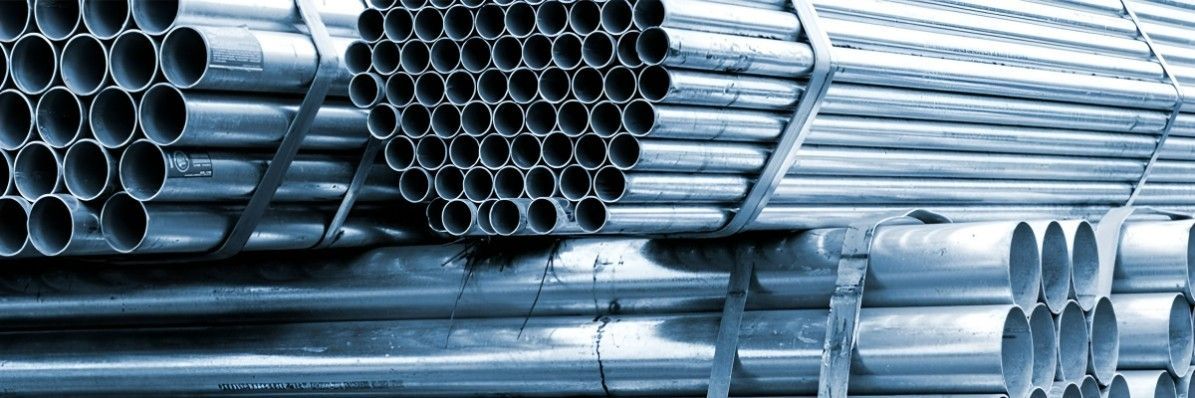 A Bunch of Metal Pipes Are Stacked on Top of Each Other — Top End Steel Supplies Darwin In Pinelands, NT