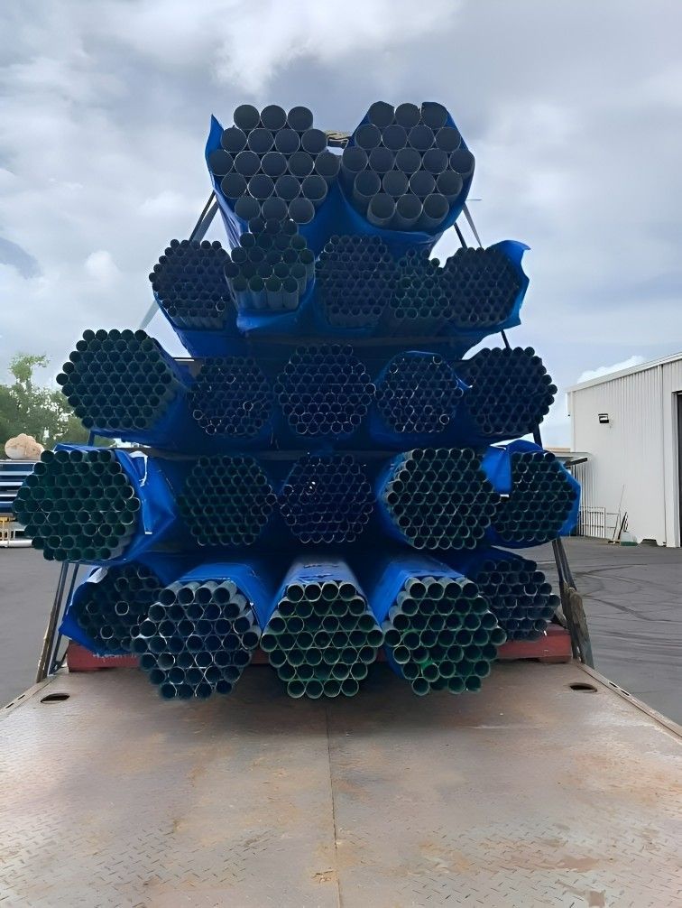 A Pile of Steel Pipes Stacked on Top of Each Other on a Truck — Top End Steel Supplies Darwin In Pinelands, NT