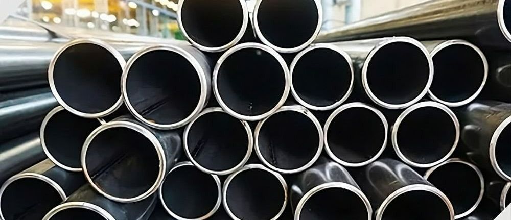 A pile of metal pipes stacked in a warehouse — Top End Steel Supplies Darwin In Pinelands, NT