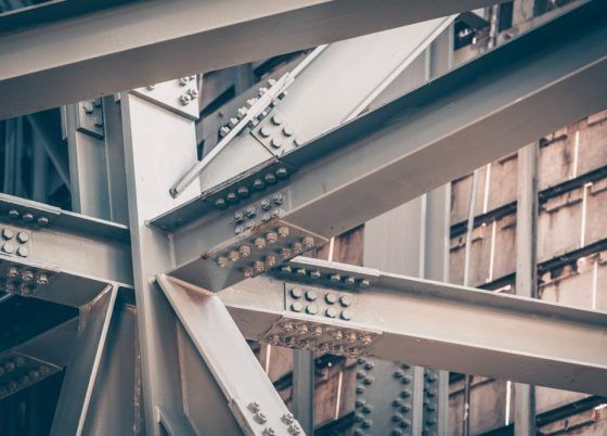 A Close Up of a Metal Structure With a Building in the Background — Top End Steel Supplies Darwin In Pinelands, NT