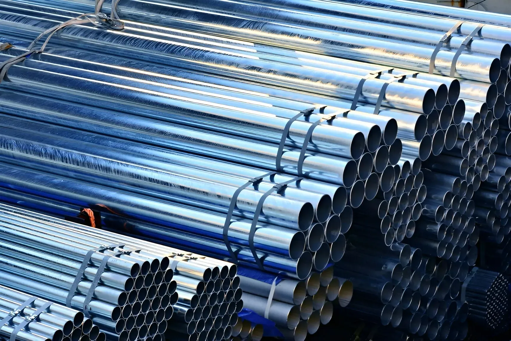 A Pile of Metal Pipes Stacked on Top of Each Other — Top End Steel Supplies Darwin In Pinelands, NT