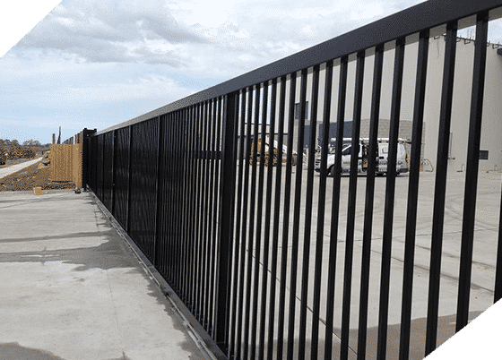 A Black Metal Fence is Surrounding a Parking Lot — Top End Steel Supplies Darwin In Pinelands, NT