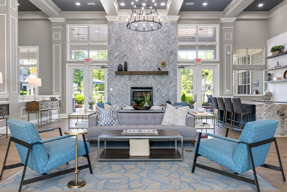 a living room filled with furniture and a fireplace at The Preserve at Ballantyne Commons in Charlotte, NC.