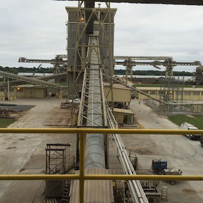 An aerial view of a factory with a conveyor belt going through it