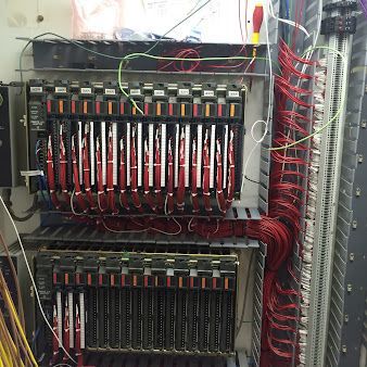 A very large electrical box with a lot of wires coming out of it.