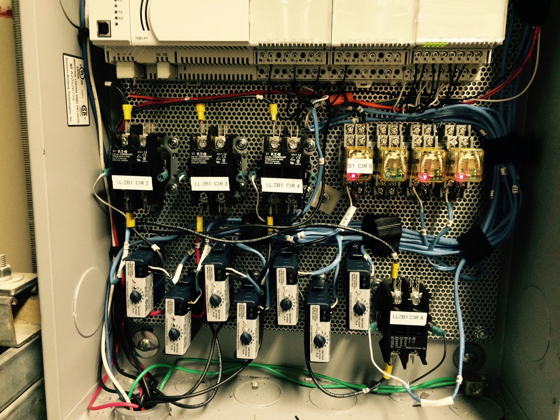 The inside of a electrical box with a lot of wires