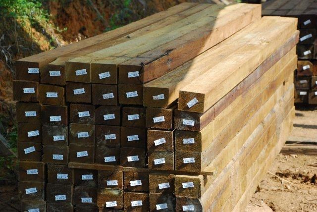 A pile of wooden blocks stacked on top of each other.