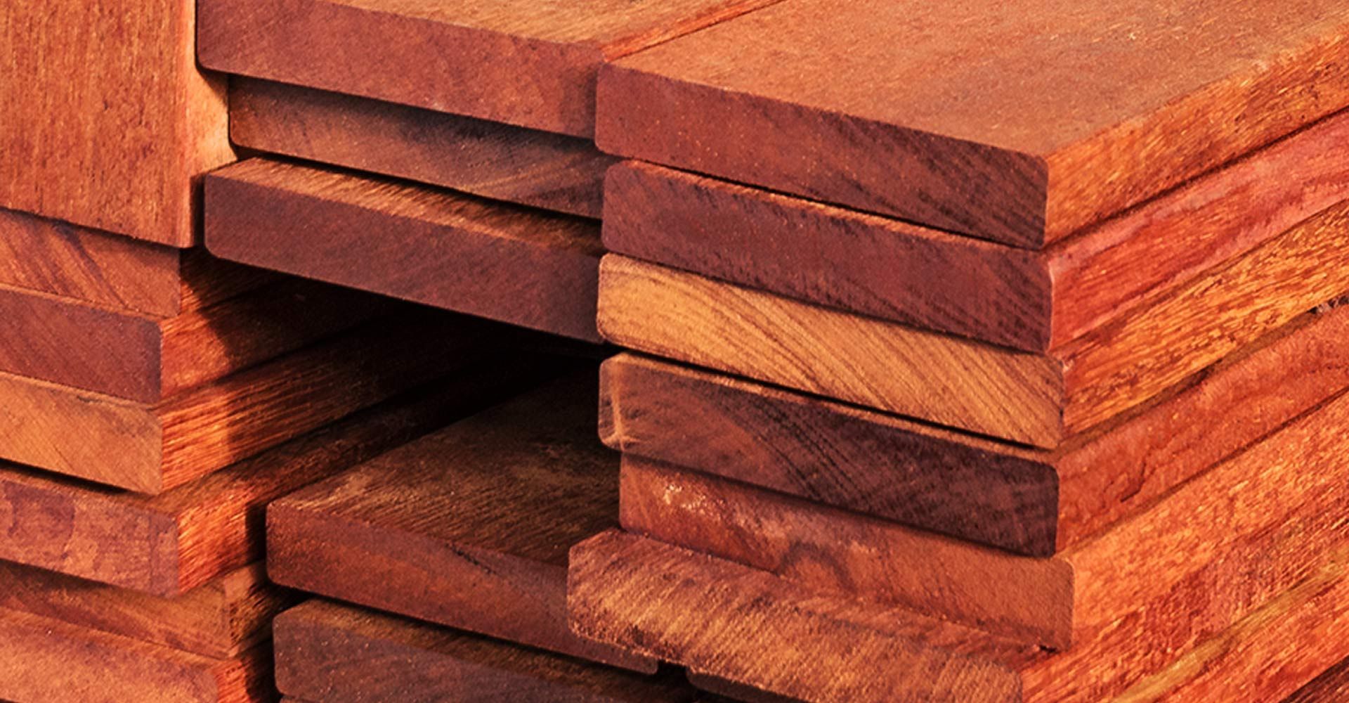 A stack of wooden boards are stacked on top of each other.