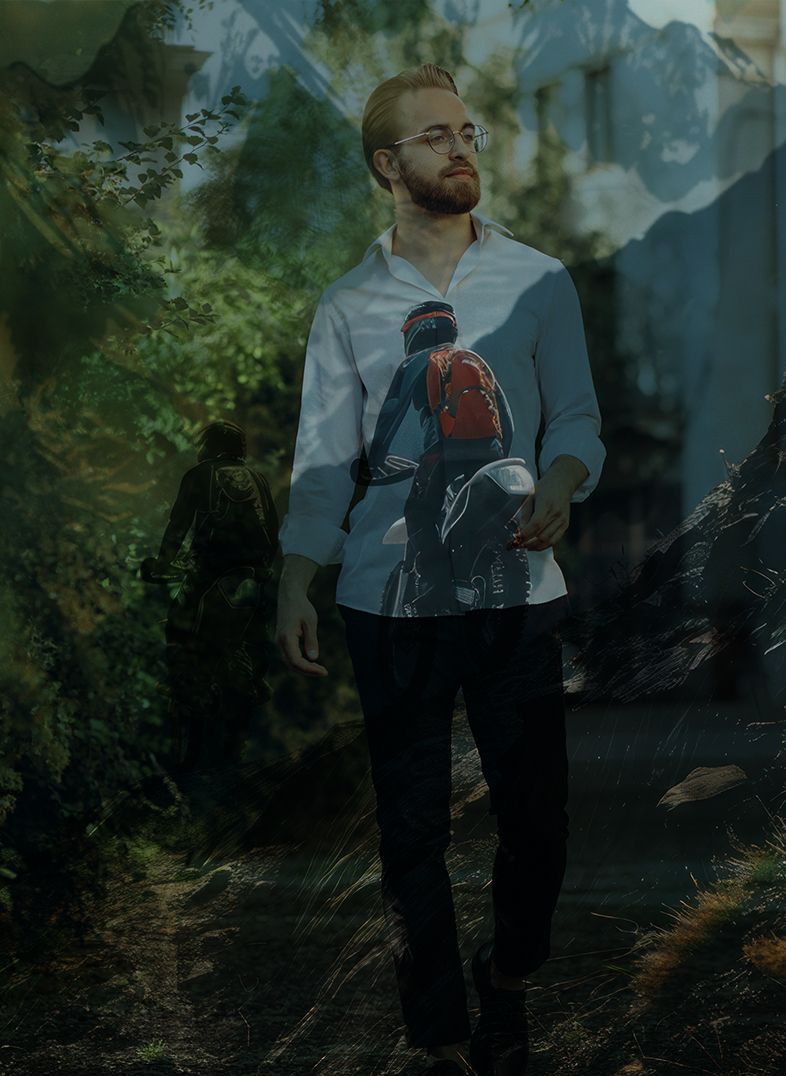 Man with glasses wearing bicycle-themed shirt, walking outdoors with landscape overlay.