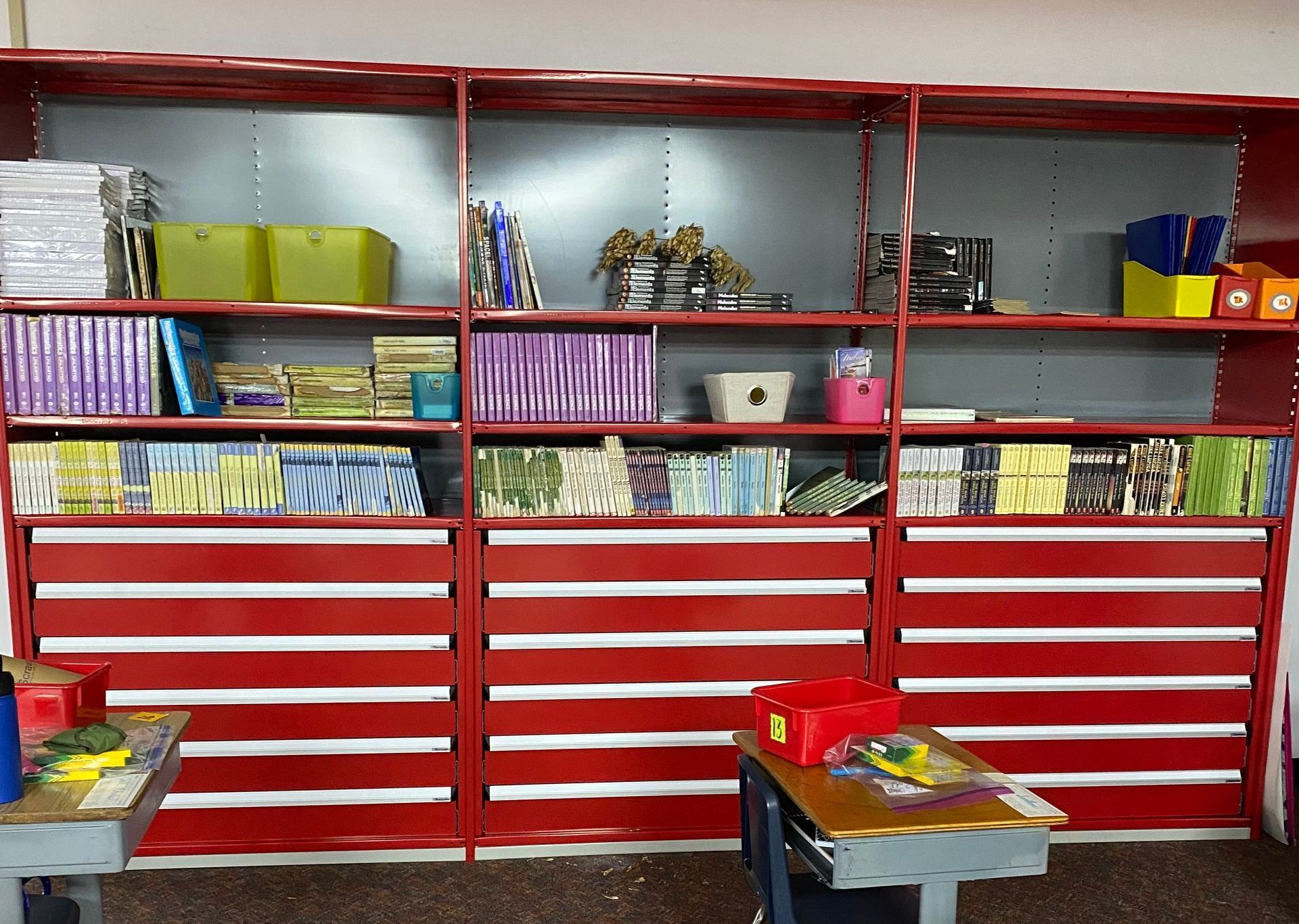 A classroom with a lot of books on the shelves