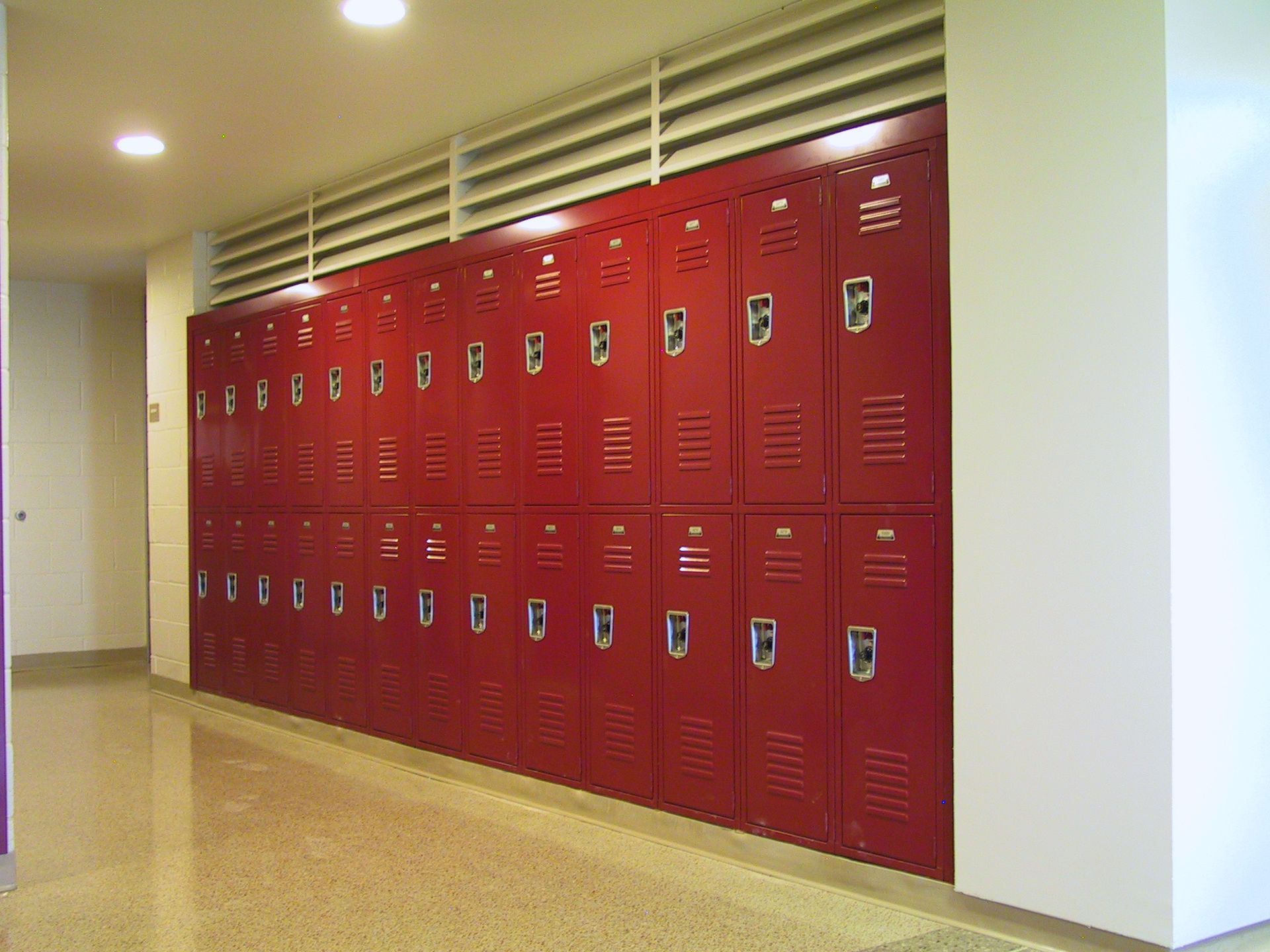 A row of red lockers with the letter b on them