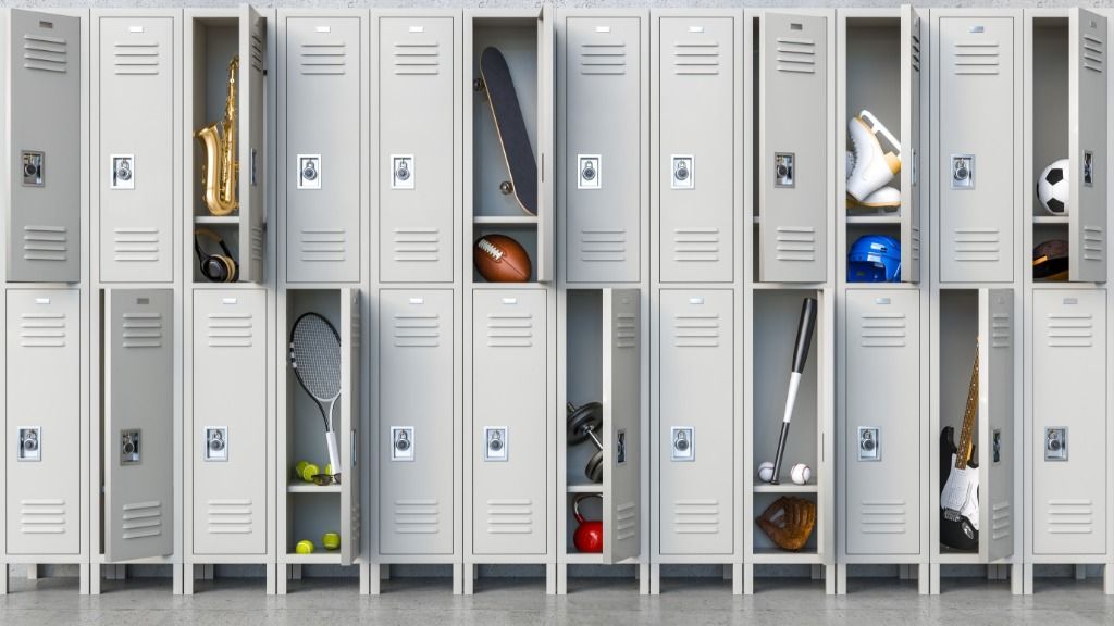 School lockers with some of them open, showing equipment for different after-school activities.