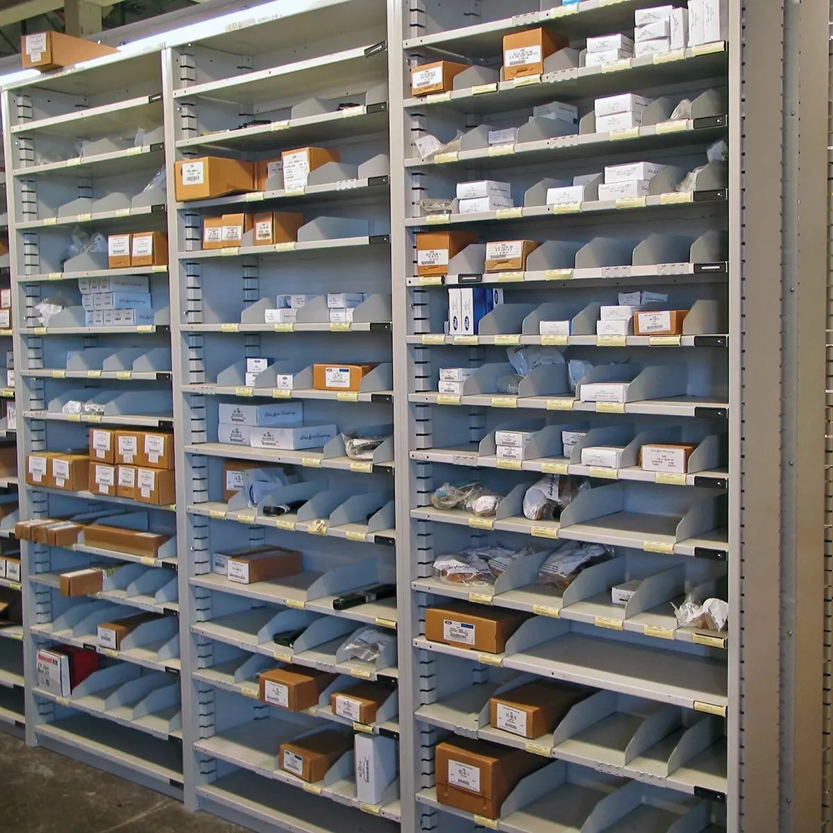 A row of shelves filled with boxes and other items