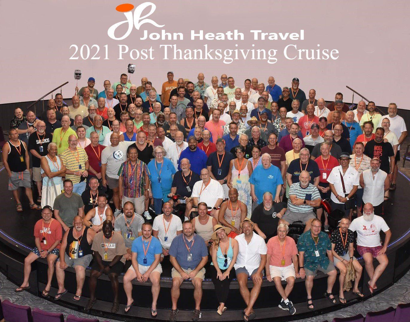 A large group of people are posing for a picture for jr john heath travel 's 2021 post thanksgiving cruise