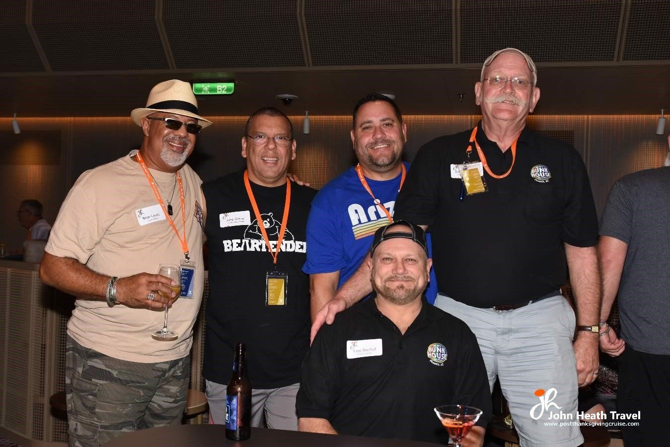 A group of men are posing for a picture at a party.