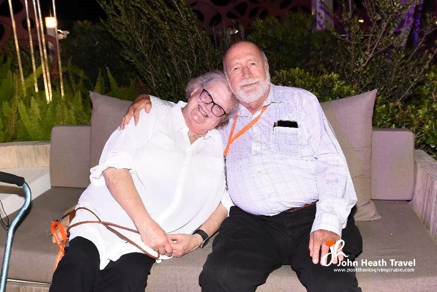 A man and a woman are sitting next to each other on a couch.
