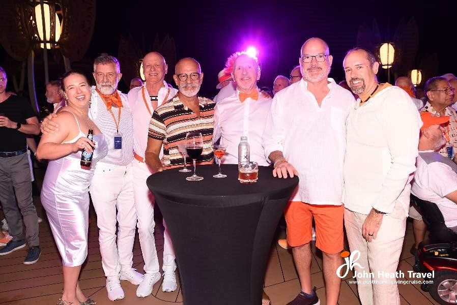 A group of people are posing for a picture at a party.