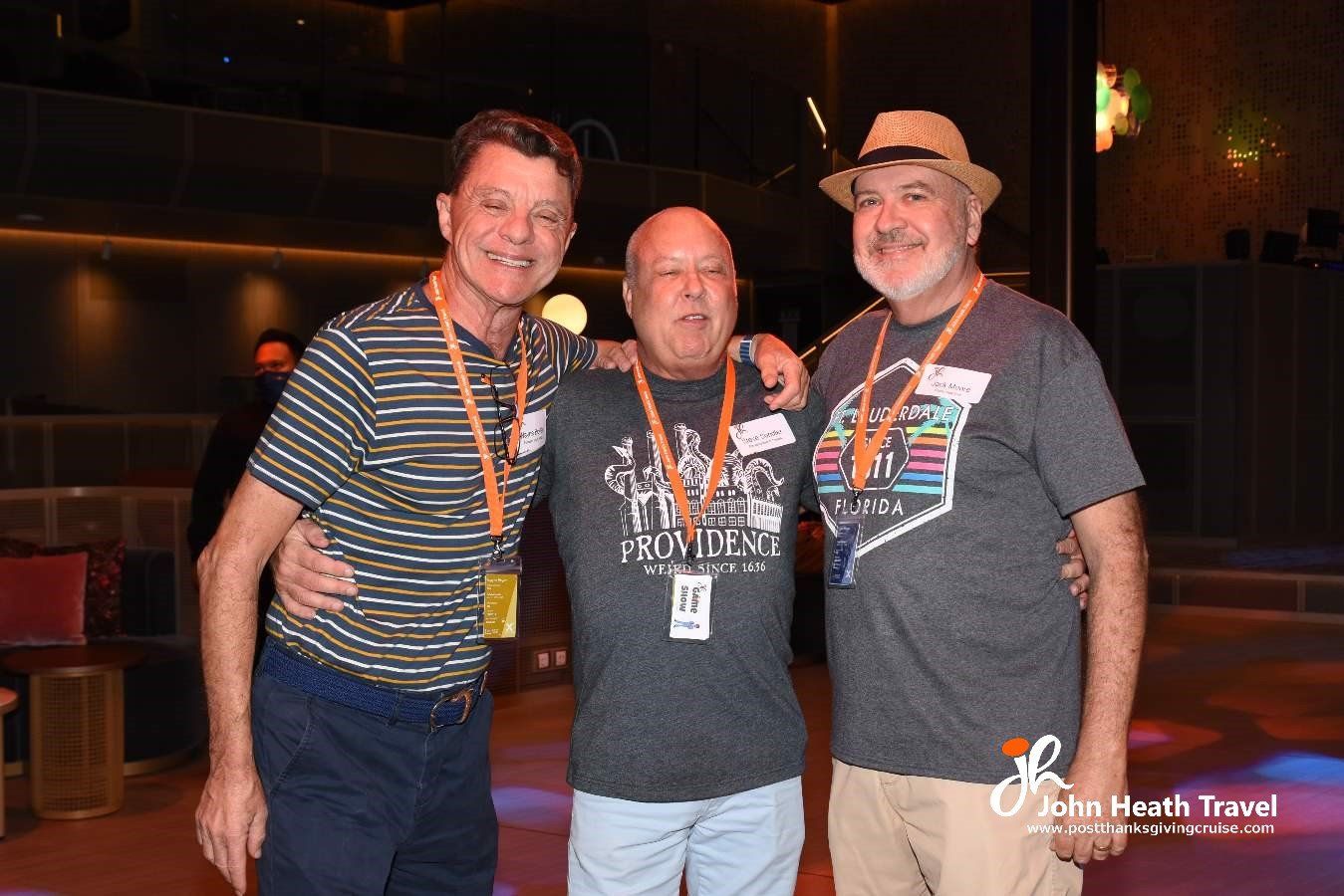 Three men are posing for a picture together in a club.