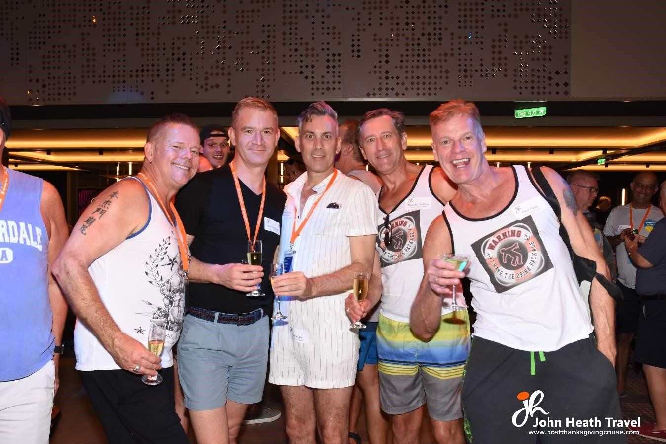 A group of men are posing for a picture in a room.