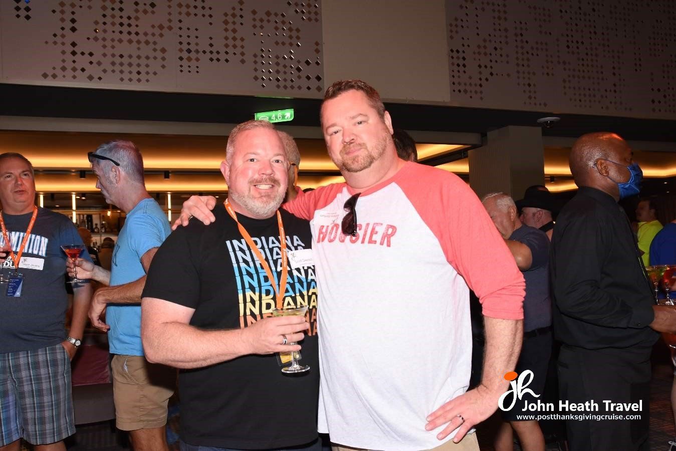 Two men posing for a picture with one wearing a shirt that says soldier