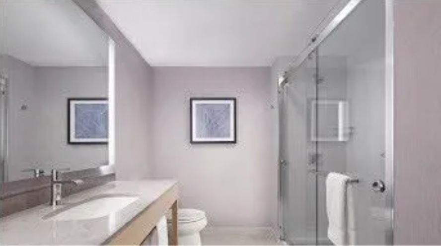 The Hyatt Place bathroom with shower.