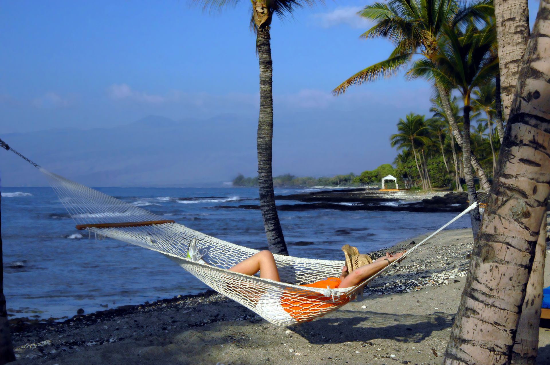 Guest relaxing in a hammock close to the ocean. 