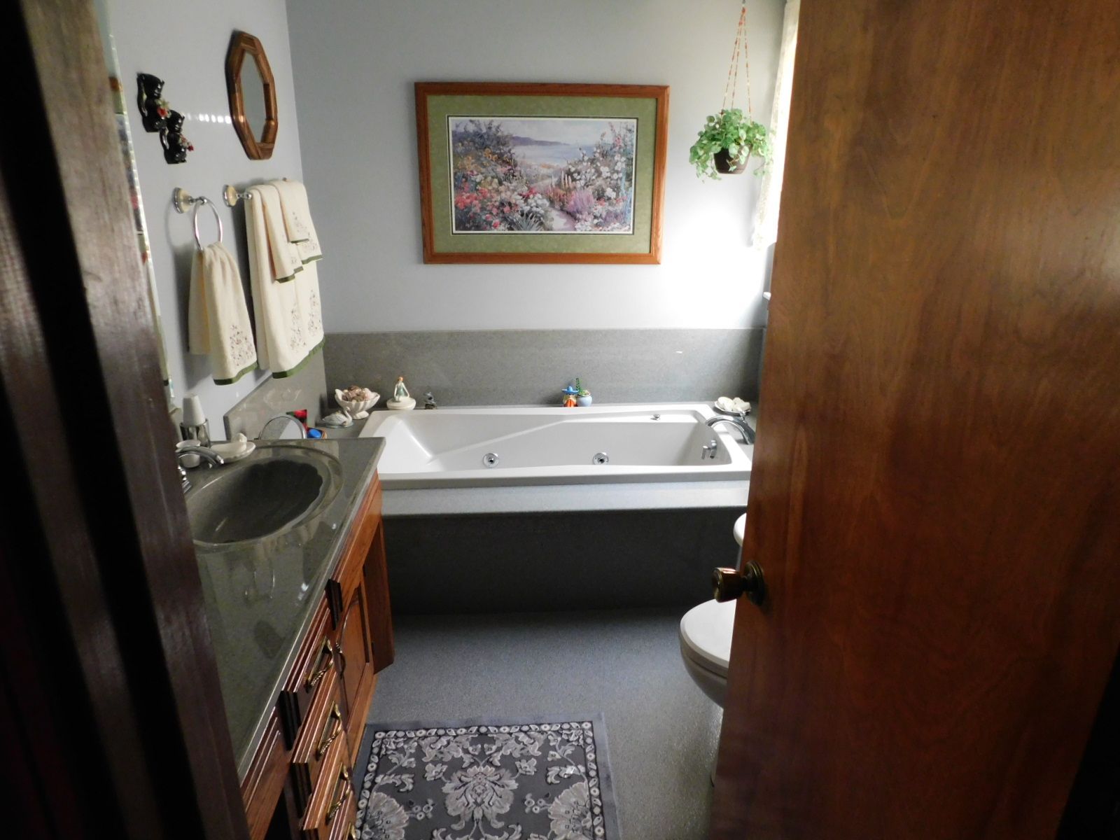 A bathroom with a bathtub sink and toilet