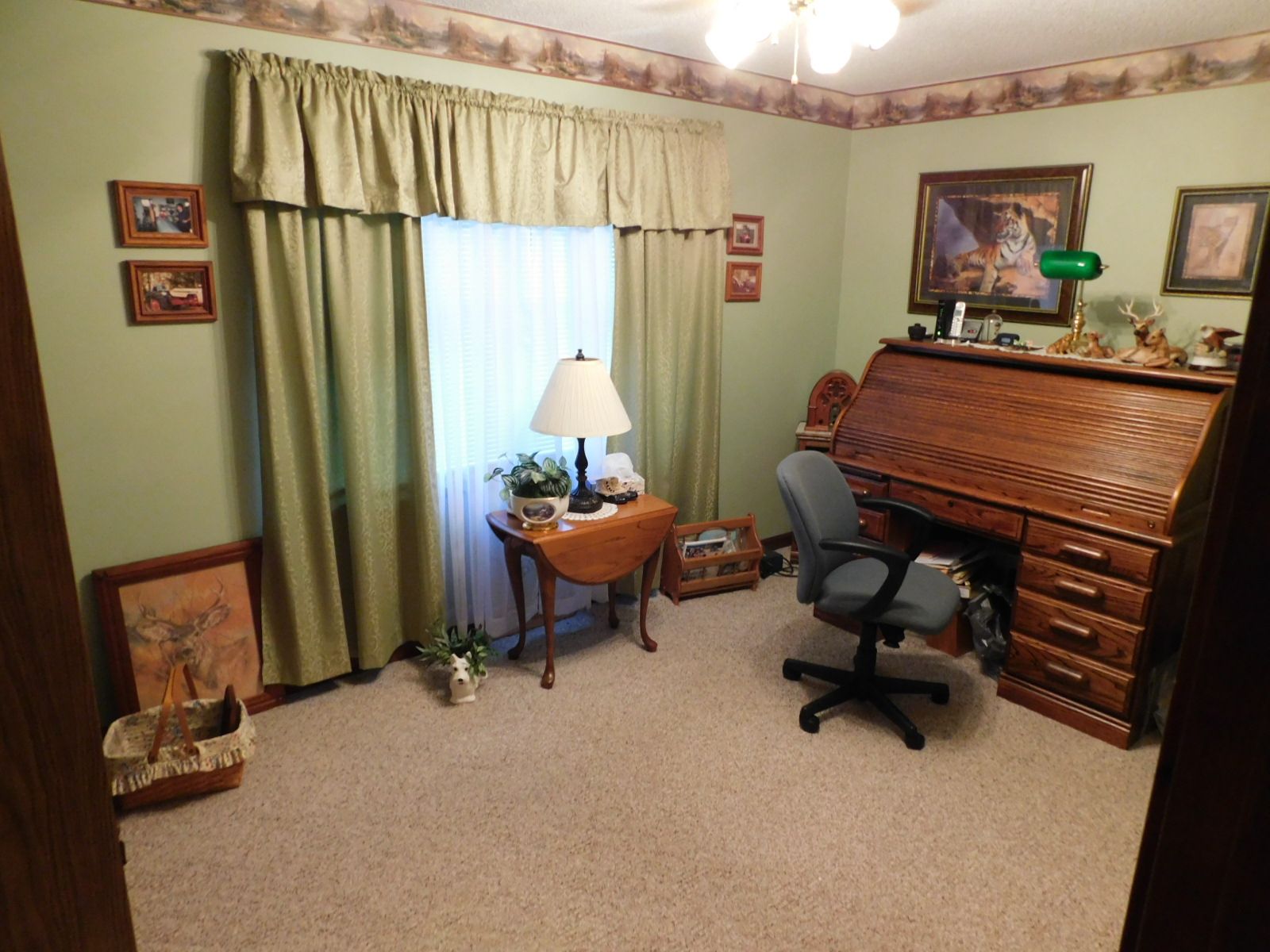 A room with a desk and chair in it