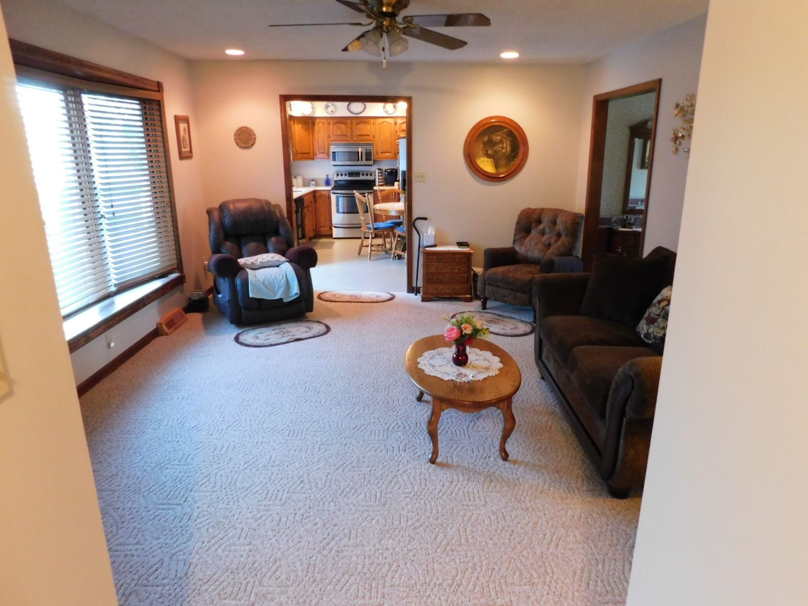 A living room with a couch a chair and a coffee table