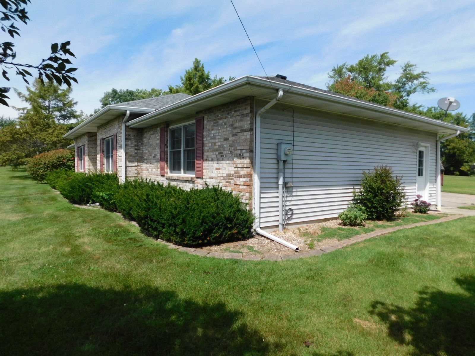 A house with a lot of grass in front of it