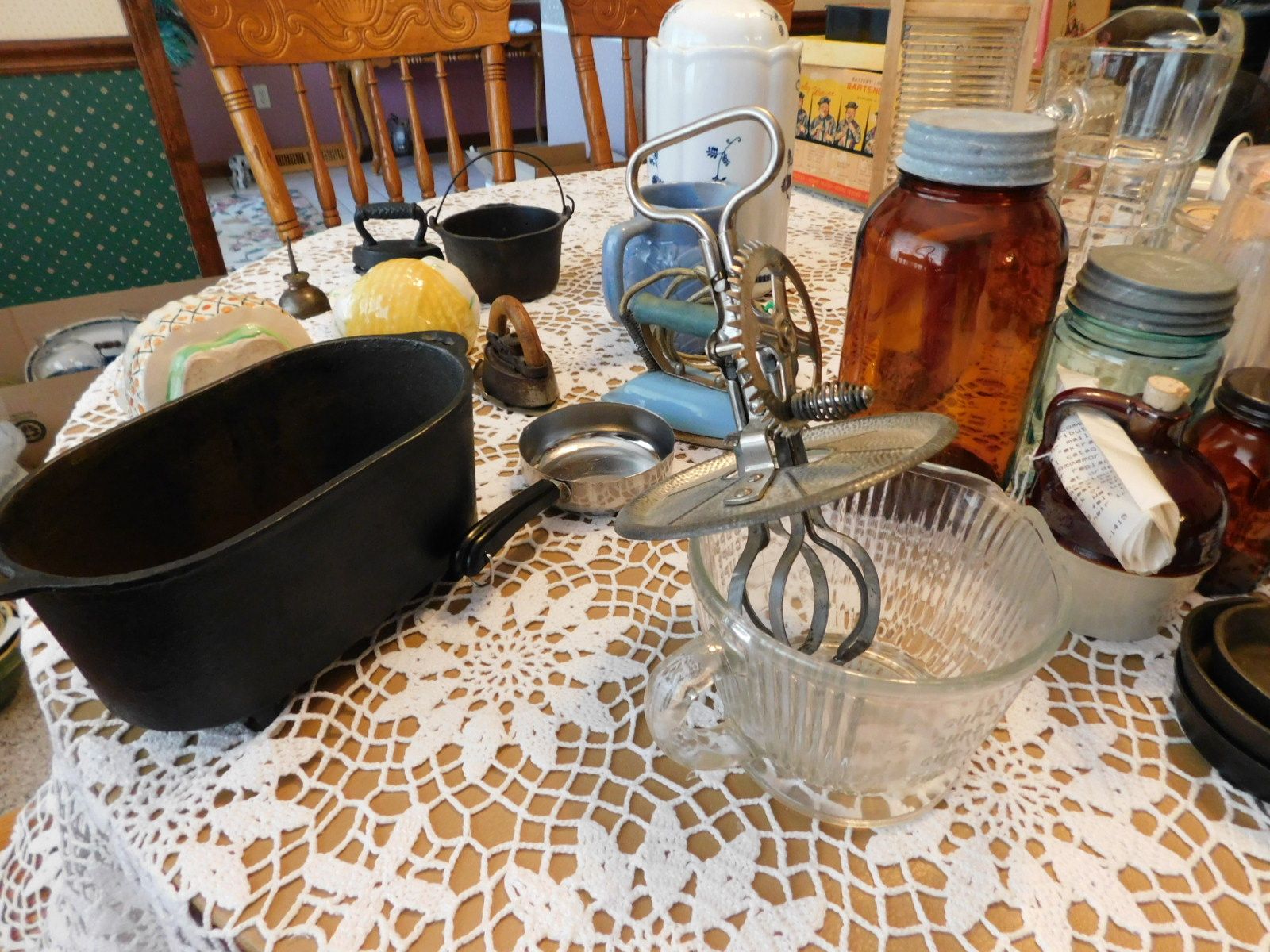 A table with a lot of kitchen utensils on it