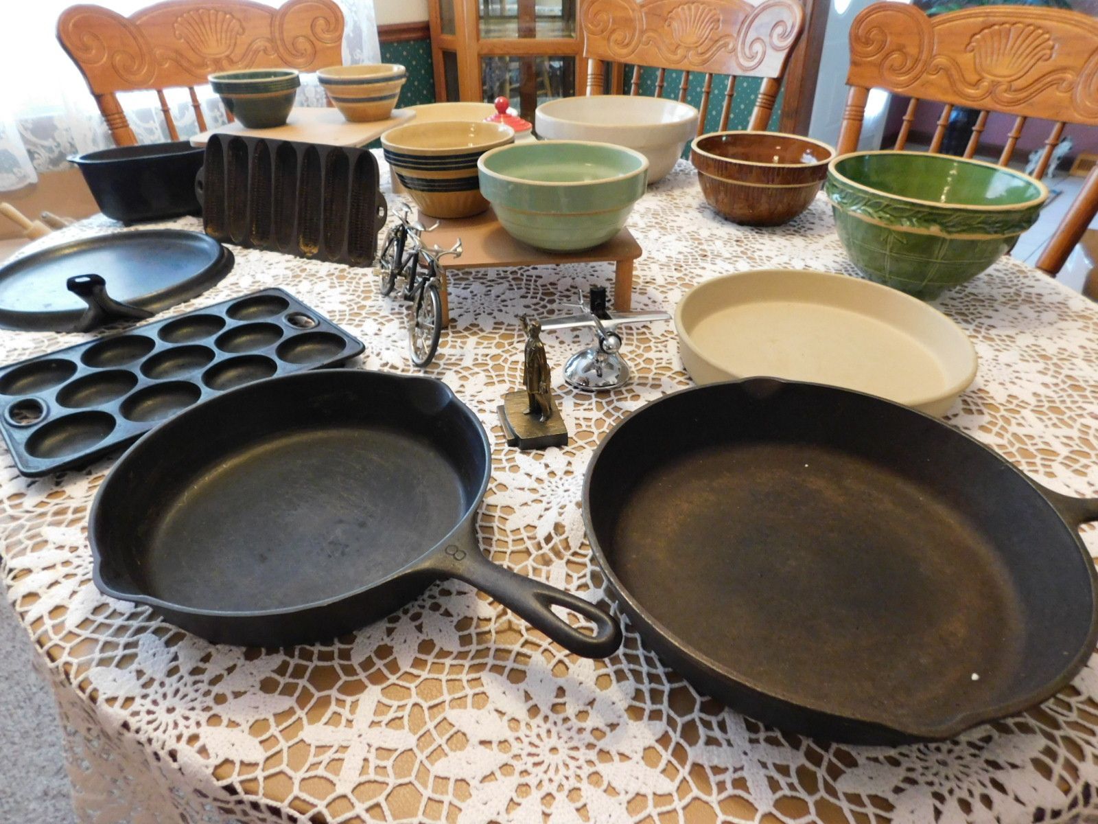 A table with a lot of bowls and pans on it