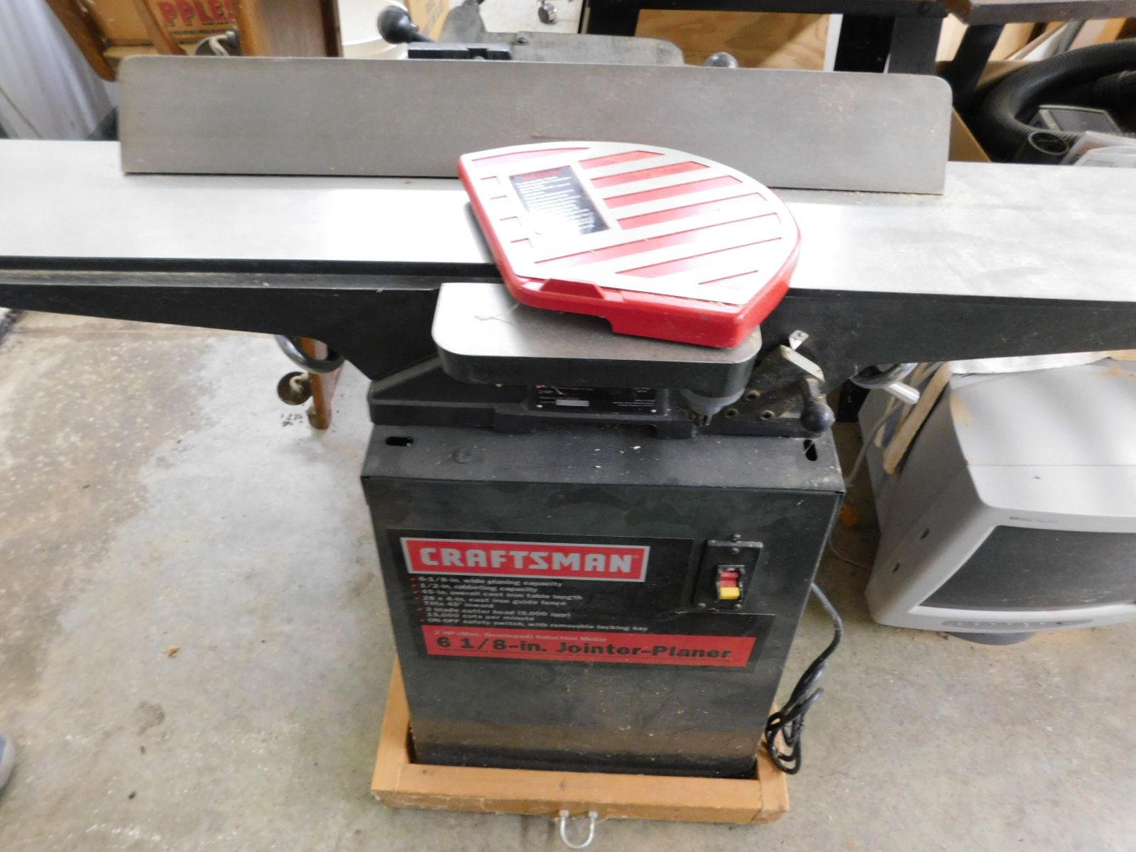 A craftsman machine is sitting on a concrete floor