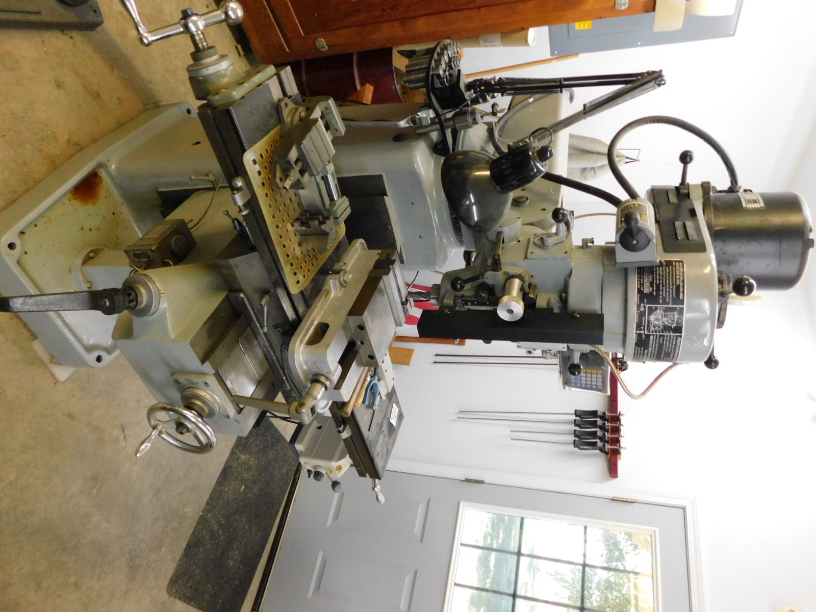 A machine is sitting in a room next to a window