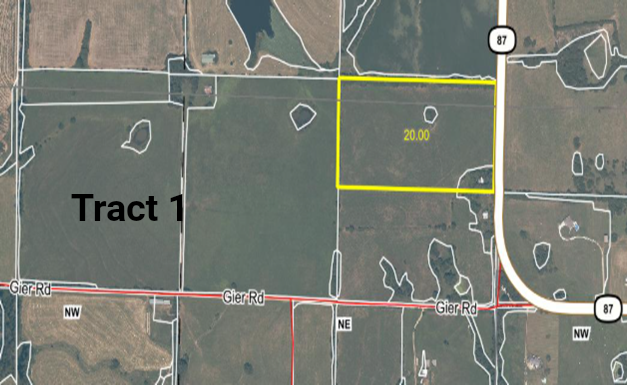 Aerial view of farmland; Tract 1 with a yellow outline, road, and other fields.