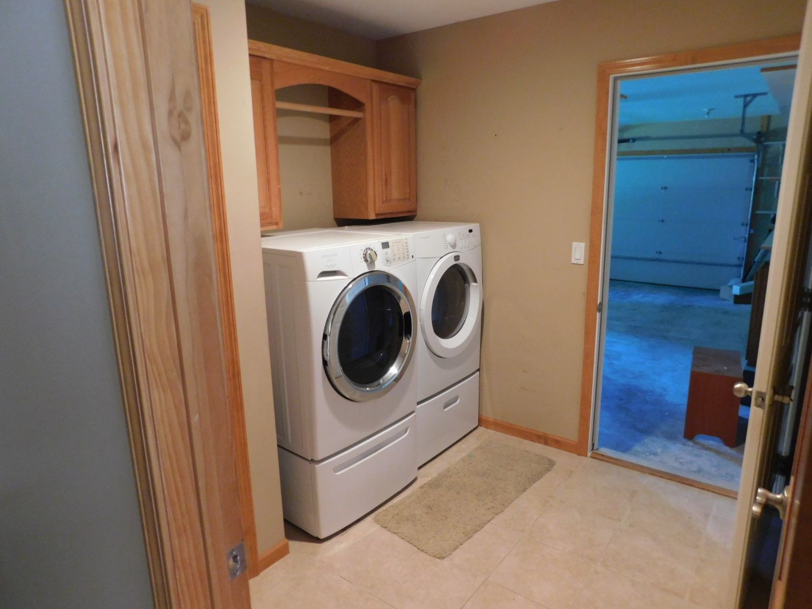 A laundry room with a washer and dryer in it