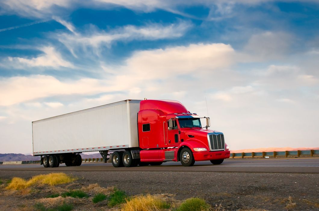 Red Truck Moving On A Highway