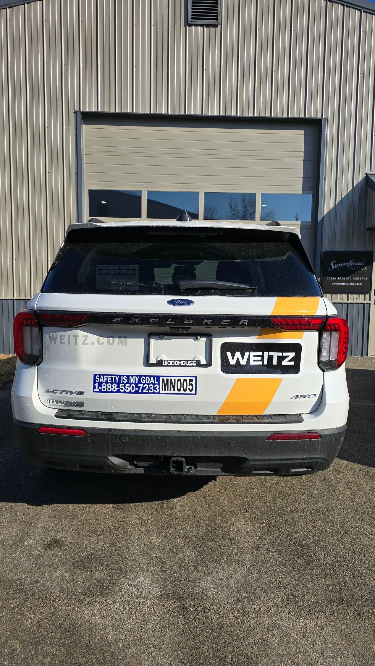 A white SUV with orange branding and 