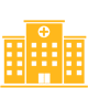 A yellow hospital building with a cross on the top of it.