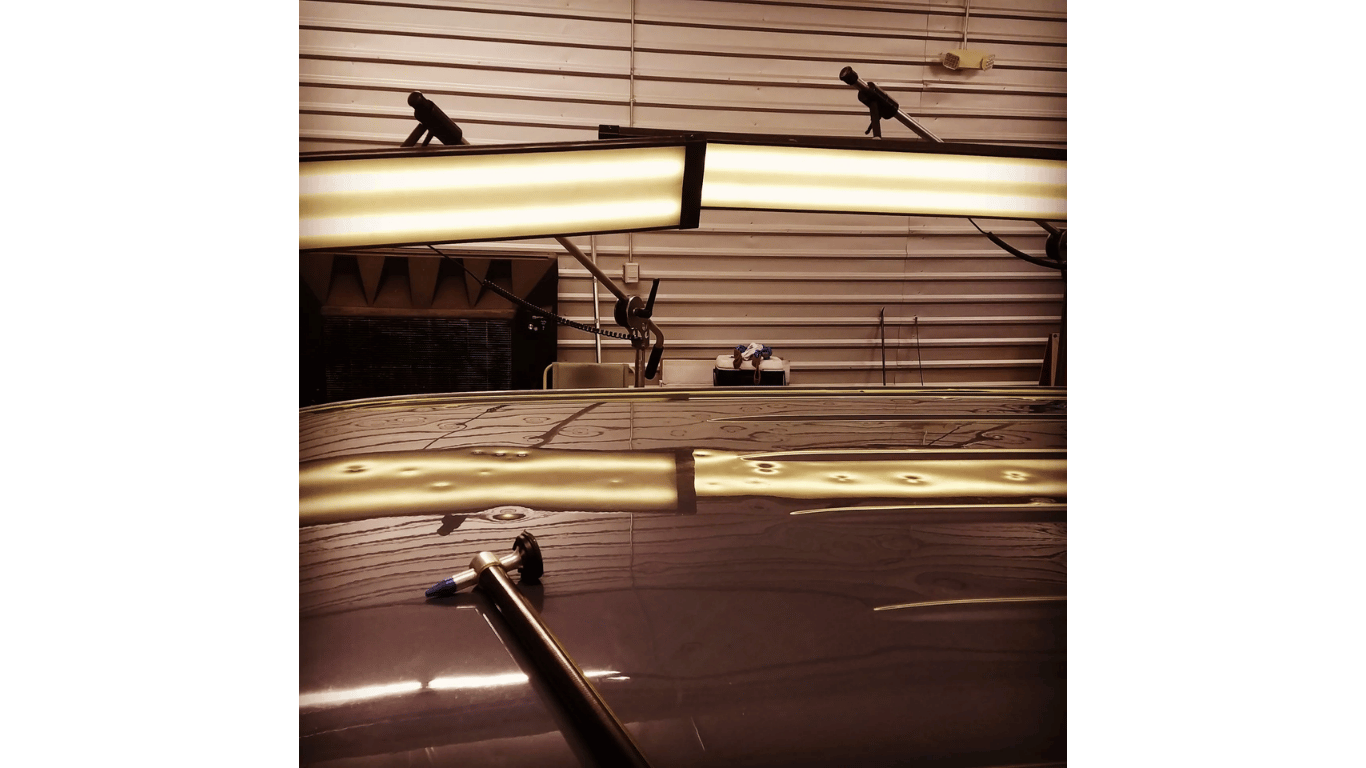 A reflection of a building in a mirror with the word max on it