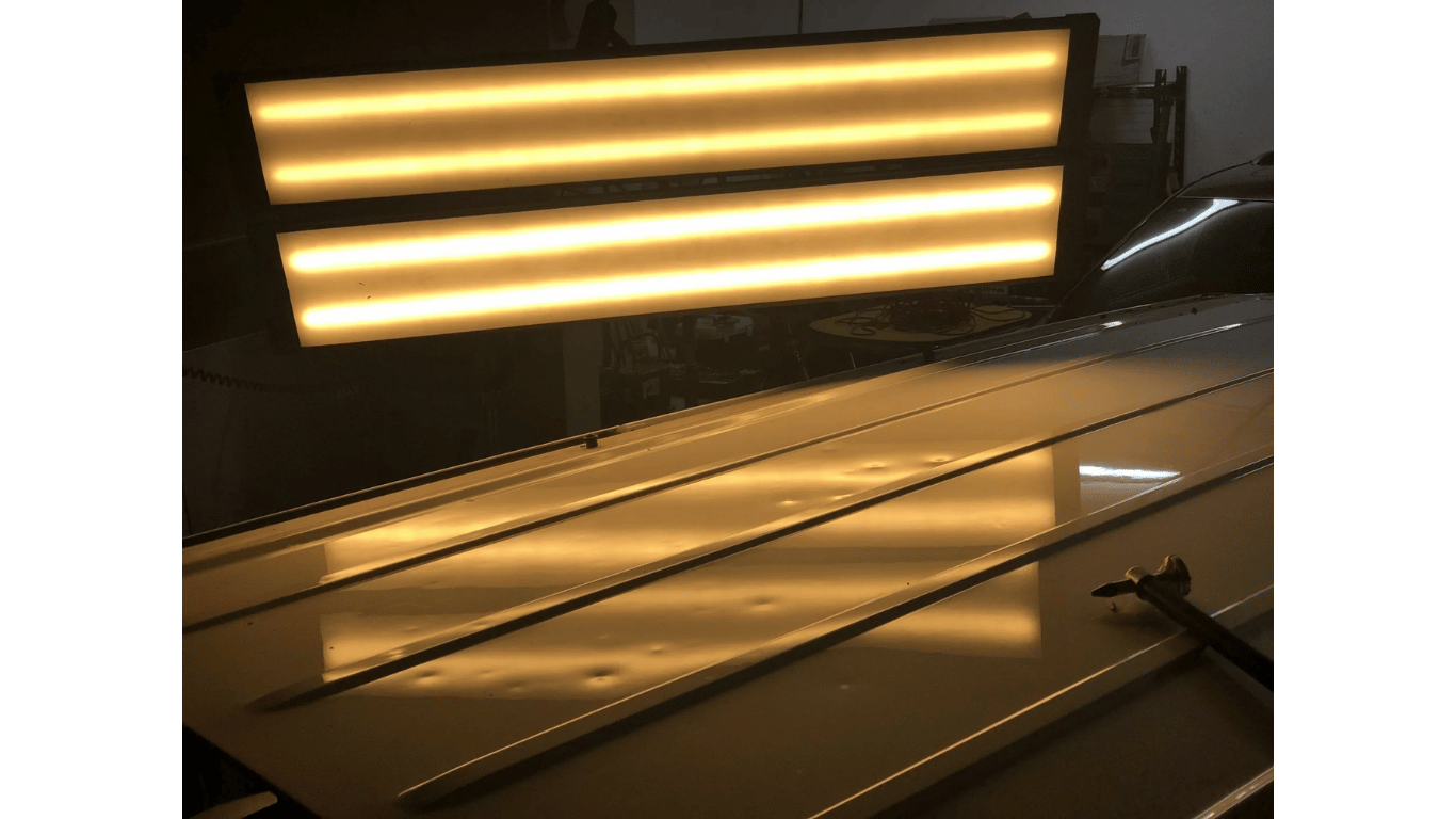 A yellow light is sitting on top of a wooden table.