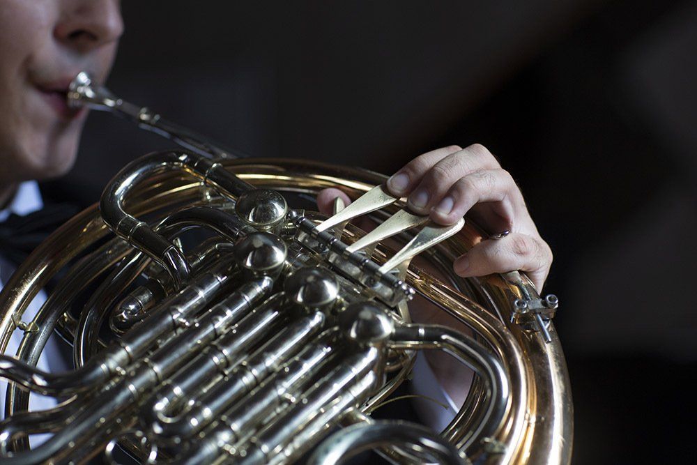 Man Playing French Horn — Cincinnati, OH — Bruce Haag Brass Studios