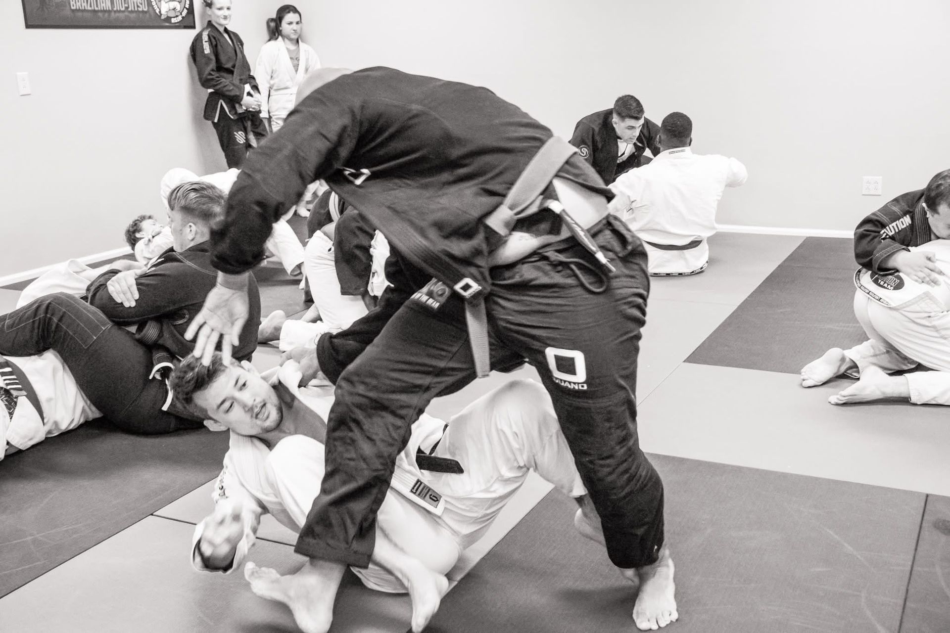 Beginners drill positional control in Brazilian Jiu-Jitsu class at Sugoi Submission.
