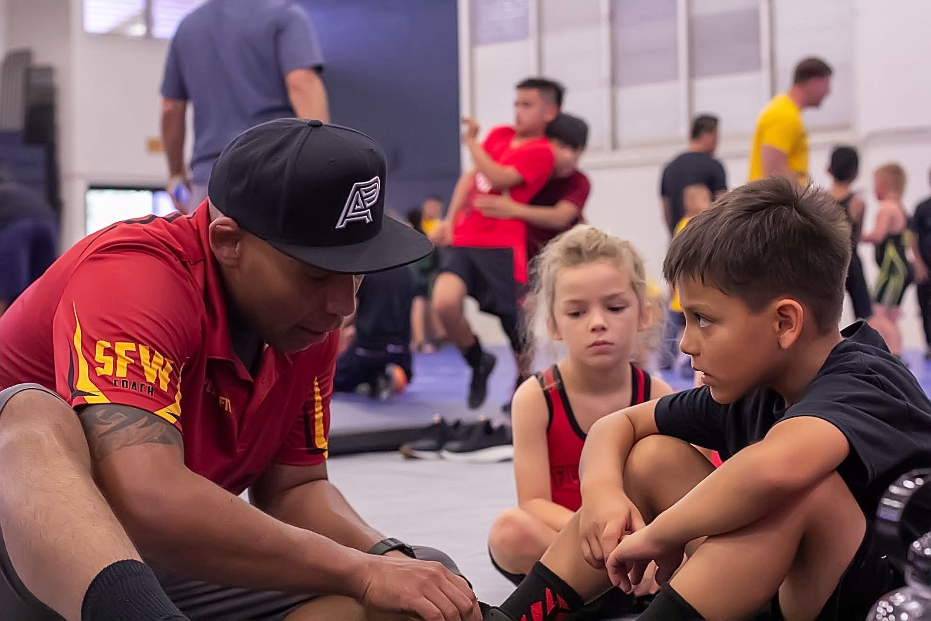 Beginners practice positional control in a Brazilian Jiu-Jitsu class at Sugoi Submission.