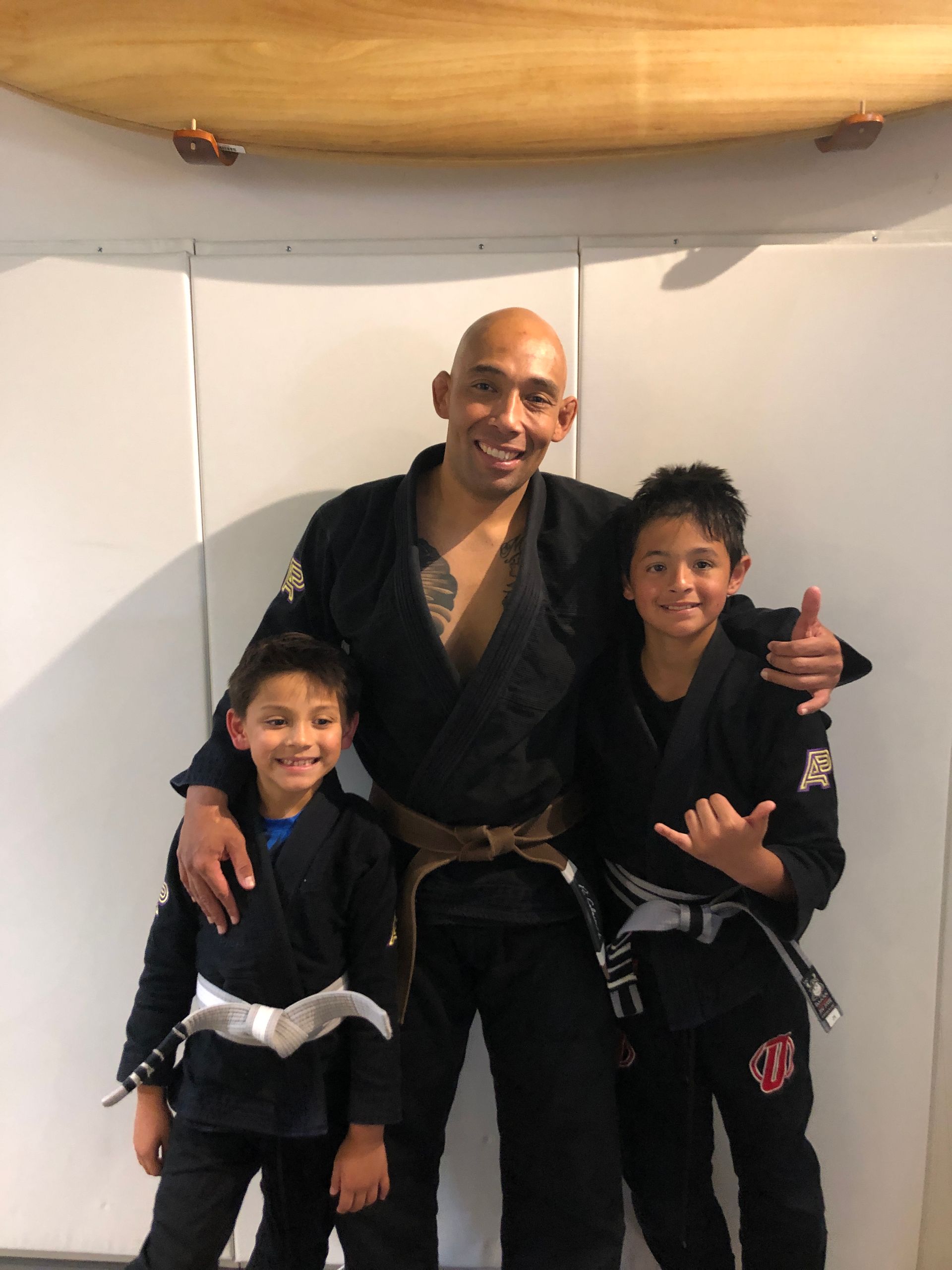 Family training Brazilian Jiu-Jitsu at Sugoi Submission in Corpus Christi, Texas, building fitness.