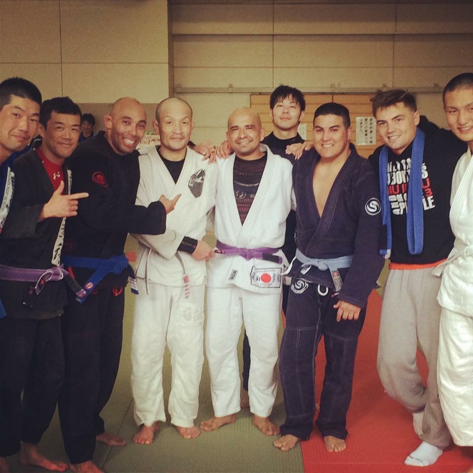 Adults drilling Brazilian Jiu-Jitsu technique at Sugoi Submission in Corpus Christi, Texas.